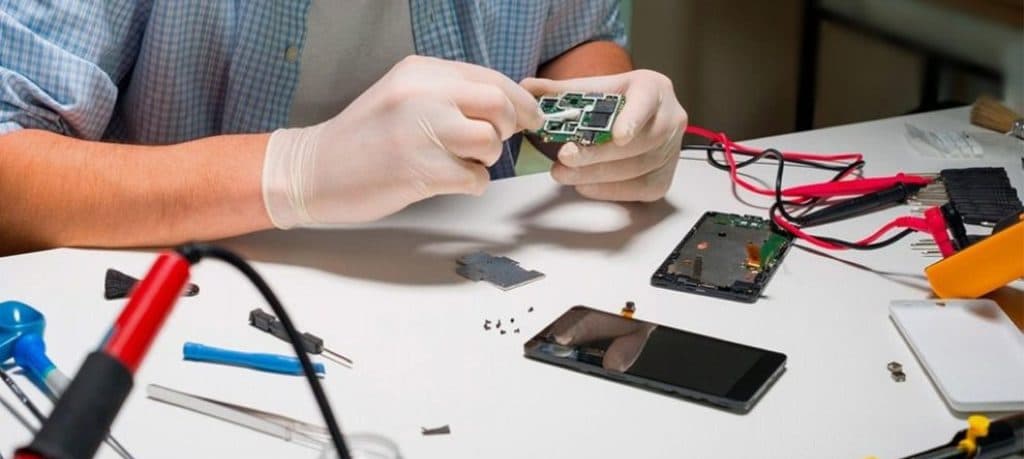 A man fixing a phone