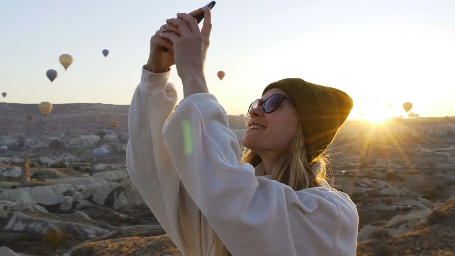 A women taking a selfie outside